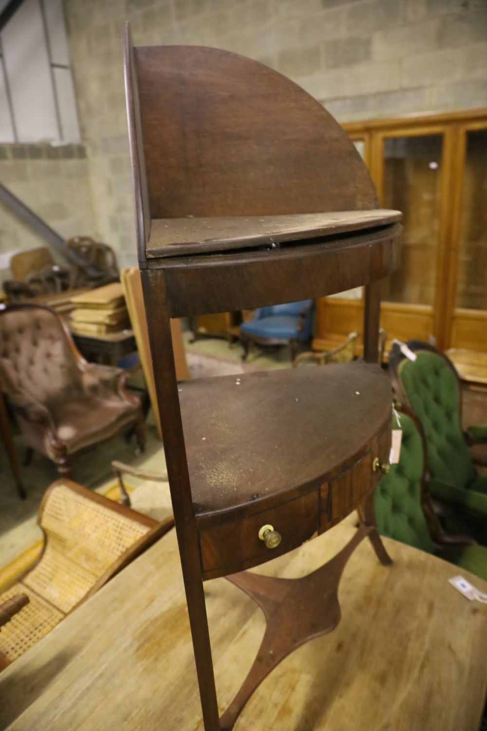 A George III mahogany bow front three tier washstand, width 58cm, depth 40cm, height 108cm